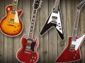 Vier Gibson E-Gitarren: Les Paul, SG, Flying V und Explorer auf Holz Hintergrund.